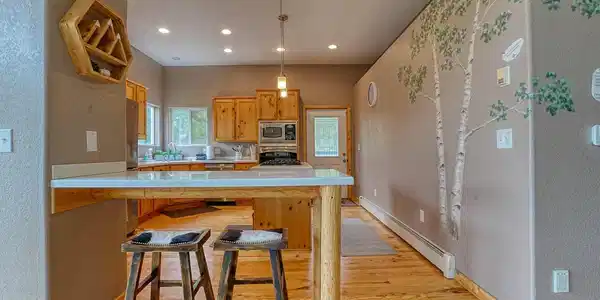 Image 3: Chefs kitchen, excellent natural light. Pine accents + custom pine cabinetry Image 3: Chefs kitchen, excellent natural light. Pine accents + custom pine cabinetry