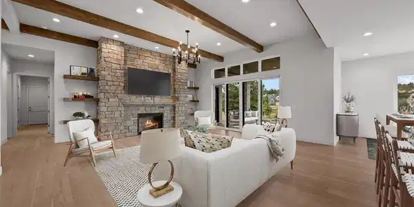 Image 3: Virtually staged to inspire - the great room centers on a striking limestone fireplace and built-in shelving, with space designed for gathering, entertaining, and everyday ease. Image 3: Virtually staged to inspire - the great room centers on a striking limestone fireplace and built-in shelving, with space designed for gathering, entertaining, and everyday ease.