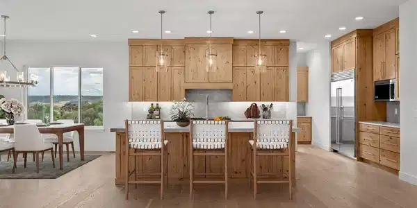 Image 4: Virtually staged to inspire - the kitchen is built for serious cooking, featuring tons of prep and storage space, a large island, and includes a Wolf range and Sub-Zero refrigeration.ovens Image 4: Virtually staged to inspire - the kitchen is built for serious cooking, featuring tons of prep and storage space, a large island, and includes a Wolf range and Sub-Zero refrigeration.ovens