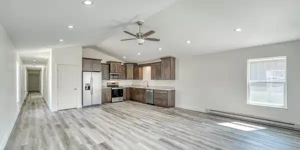 Image 3: Open concept living room, dining room and kitchen. Hall leads to bedrooms and attached garage. Image 3: Open concept living room, dining room and kitchen. Hall leads to bedrooms and attached garage.