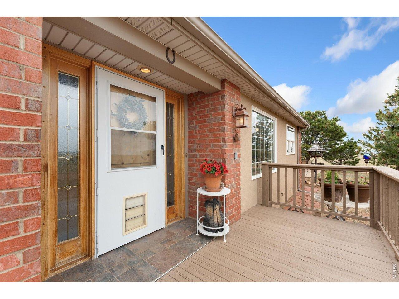 Image 3: Welcoming front porch with beautiful views