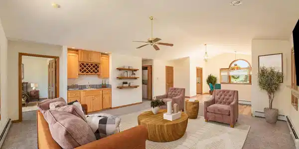 Image 4: Living room with wet bar. (Digitally furnished). Image 4: Living room with wet bar. (Digitally furnished).