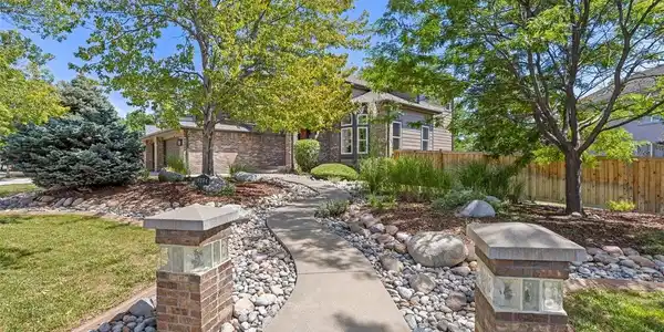 Image 2: Expansive corner lot with professional landscaping. Image 2: Expansive corner lot with professional landscaping.