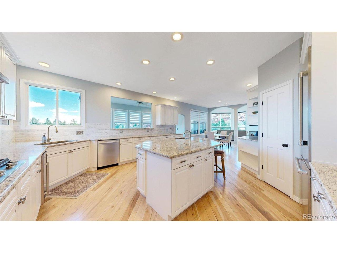 Image 3: The kitchen is expansive and features stainless appliances, center island, lots of counterspace and cabinetry, and wonderful views while doing dishes! Image 3: The kitchen is expansive and features stainless appliances, center island, lots of counterspace and cabinetry, and wonderful views while doing dishes!