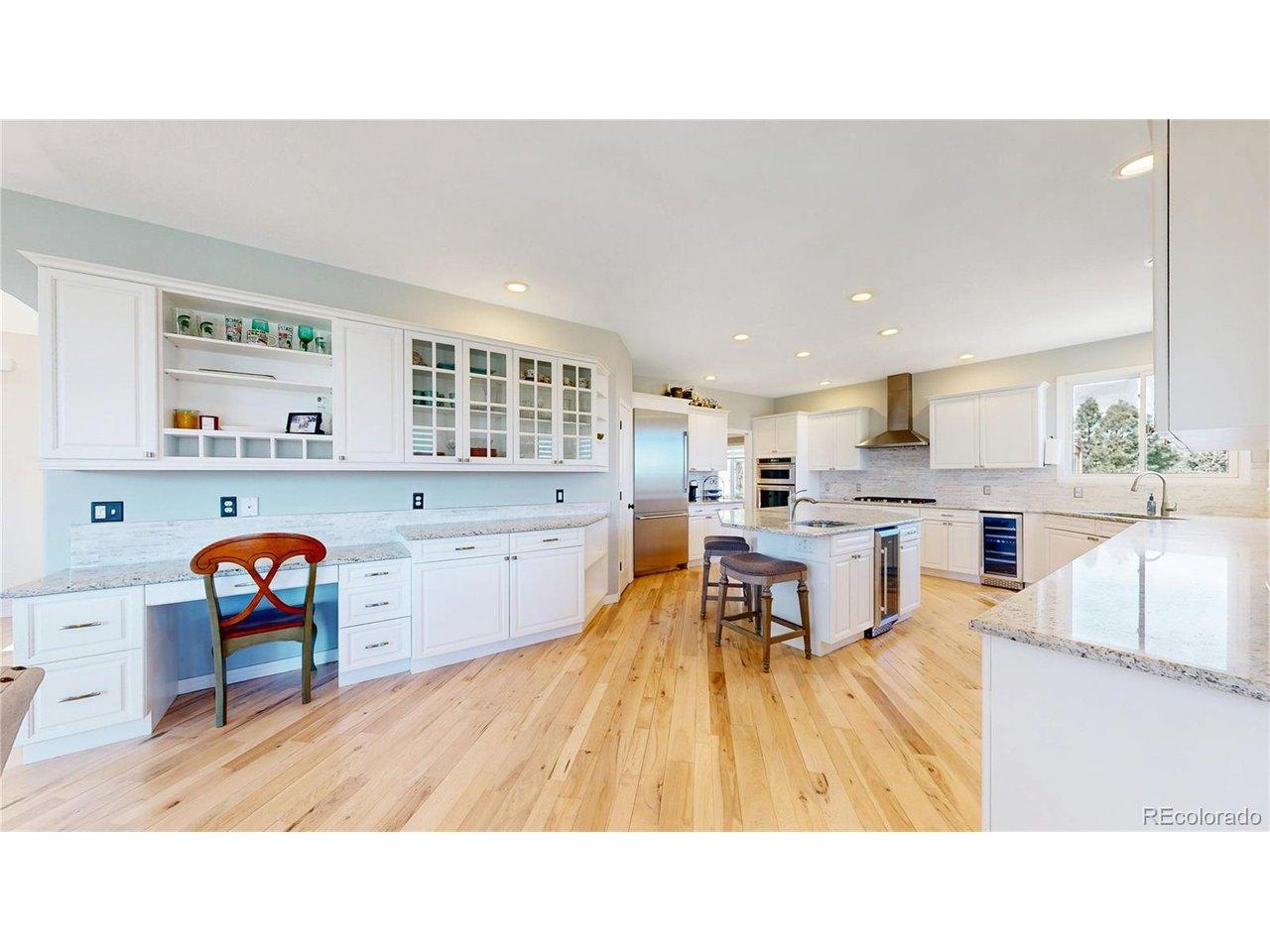 Image 4: The kitchen has a built-in desk, built in shelving, and some glass fronted cabinets. Image 4: The kitchen has a built-in desk, built in shelving, and some glass fronted cabinets.