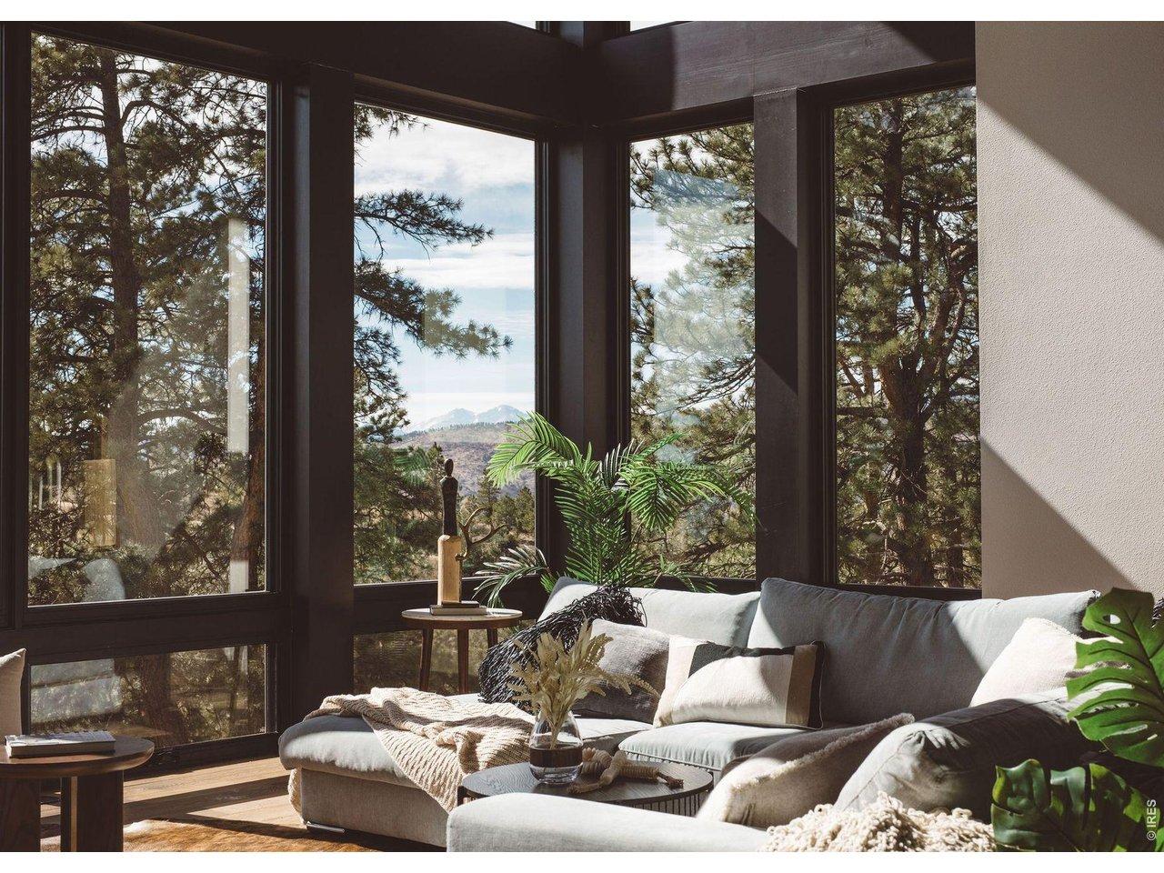 Image 4: Windows from floor to ceiling with views of longs peak Image 4: Windows from floor to ceiling with views of longs peak