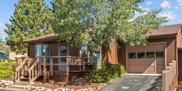 Image 3: Front porch with built in benches and attached one car garage Image 3: Front porch with built in benches and attached one car garage
