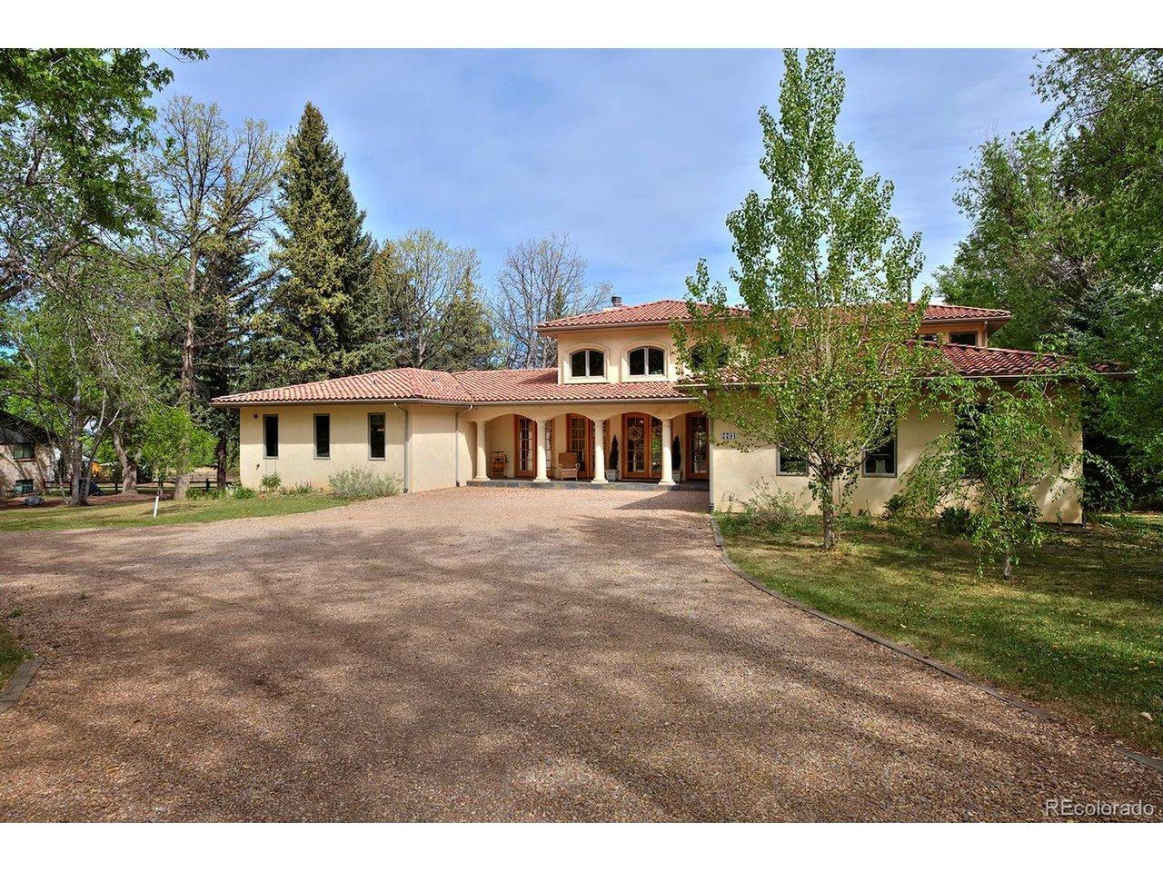 Image 4: Mature trees frame the Tuscan-style exterior Image 4: Mature trees frame the Tuscan-style exterior