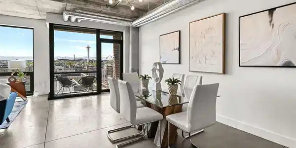 Image 3: Perfect for entertaining, the open-concept dining space easily accommodates a full-size table