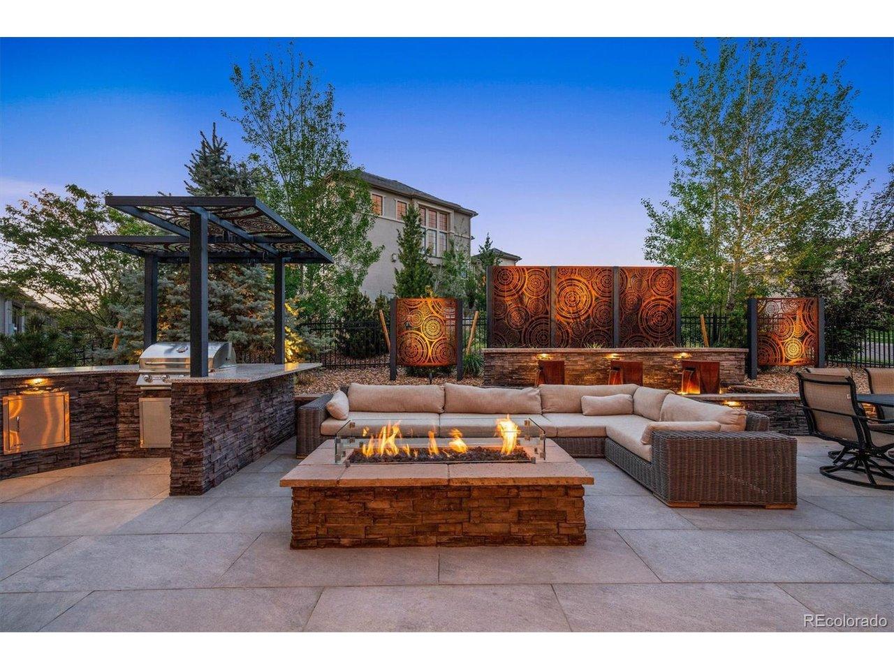 Image 4: Built-in firepit, outdoor kitchen, and privacy fence for outdoor entertaining. Image 4: Built-in firepit, outdoor kitchen, and privacy fence for outdoor entertaining.