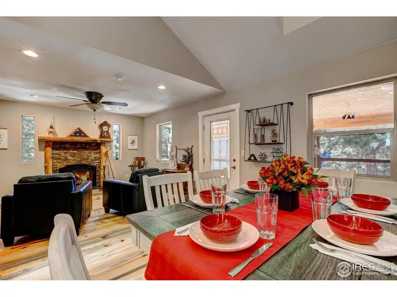 Image 1: Dining-room adjacent to the cozy sitting room with a high-efficiency wood fireplace