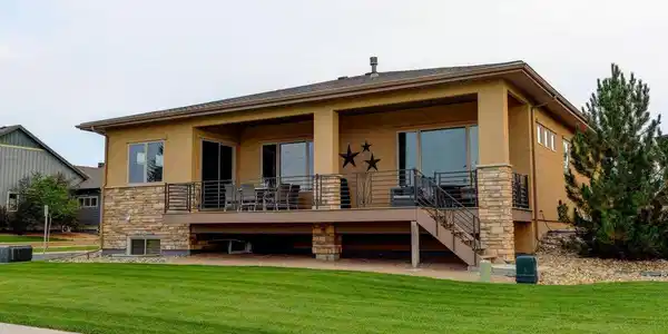 Image 4: Large covered back patio with Mountain views and open fields. Daylight Basement Image 4: Large covered back patio with Mountain views and open fields. Daylight Basement