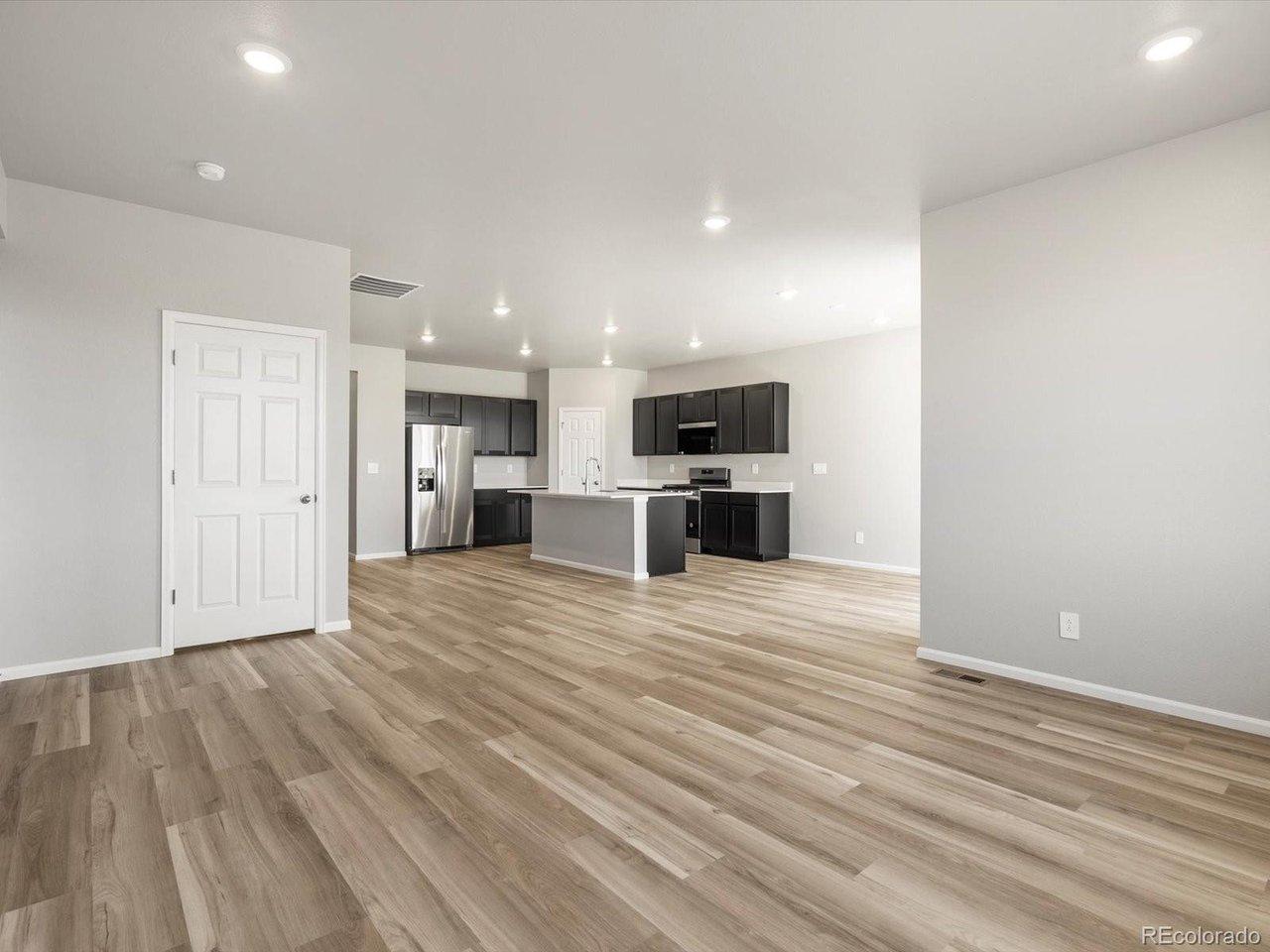 Image 4: *Interior photos are representative only and not of the actual home. Actual elevations, appliance models and interior finishes may vary.