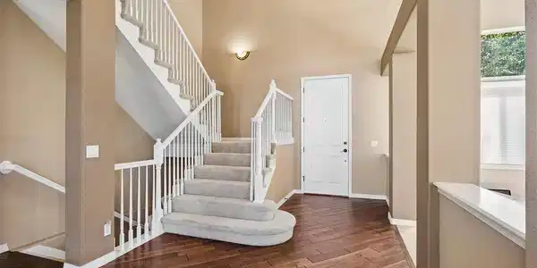Image 3: Welcoming Foyer with Elegant Staircase Image 3: Welcoming Foyer with Elegant Staircase