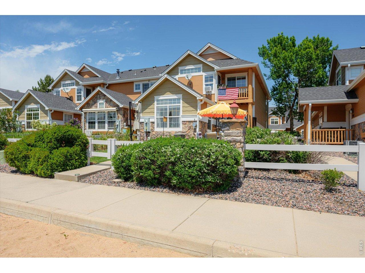 Image 3: Lock & Leave to Enjoy 27 Holes of Golf, Lakes, Pool, Restaurants, Clubhouse, Trails, Parks, Tennis-All Golf Cart Accessible! View of Front of Townhome- Primary Bedroom Has Balcony Overlooking the Lake! Image 3: Lock & Leave to Enjoy 27 Holes of Golf, Lakes, Pool, Restaurants, Clubhouse, Trails, Parks, Tennis-All Golf Cart Accessible! View of Front of Townhome- Primary Bedroom Has Balcony Overlooking the Lake!