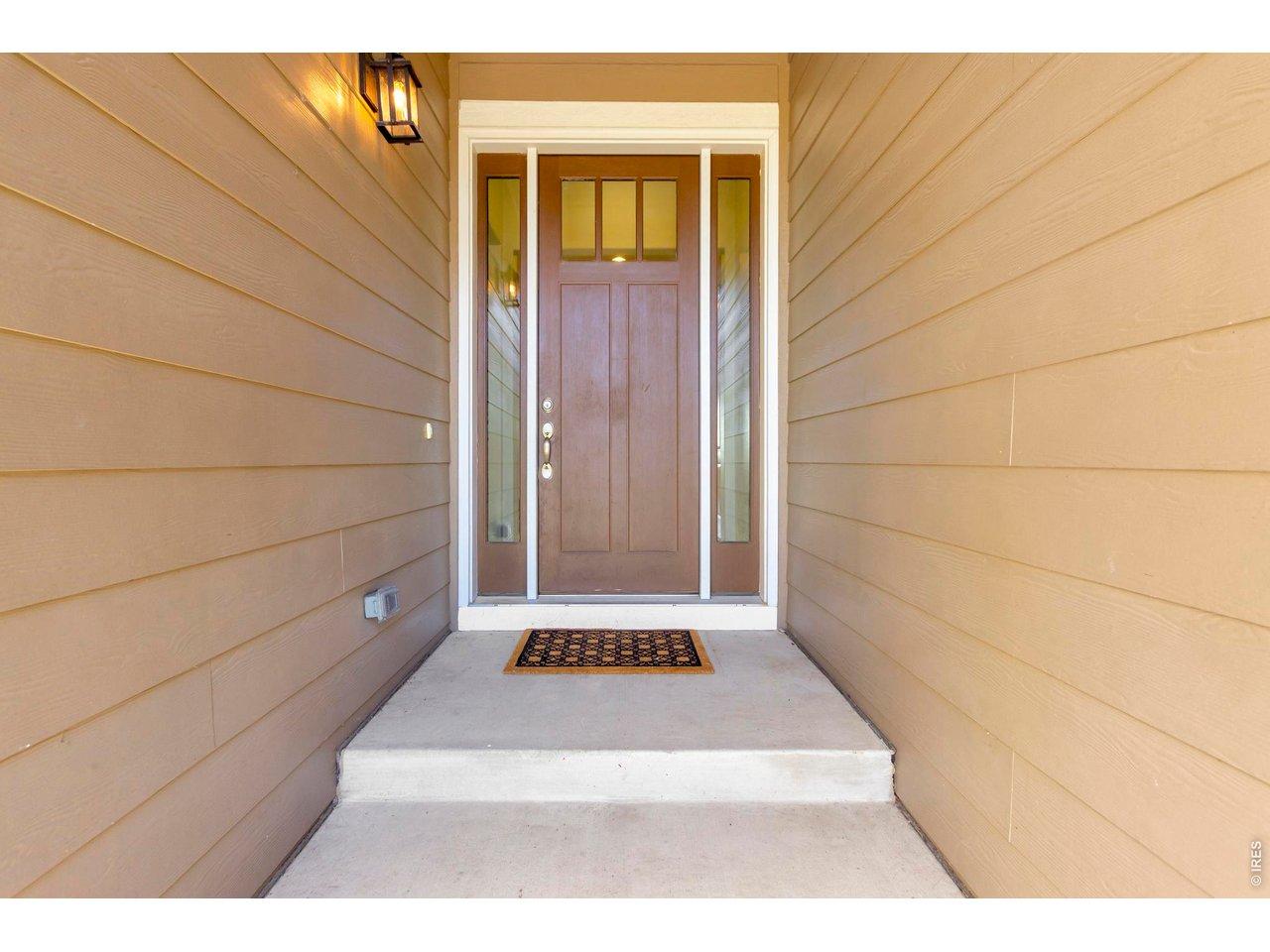 Image 4: A charming covered entry creates a warm and elegant welcome into this thoughtfully designed home. Image 4: A charming covered entry creates a warm and elegant welcome into this thoughtfully designed home.