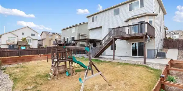 Image 3: Backyard with included playset Image 3: Backyard with included playset