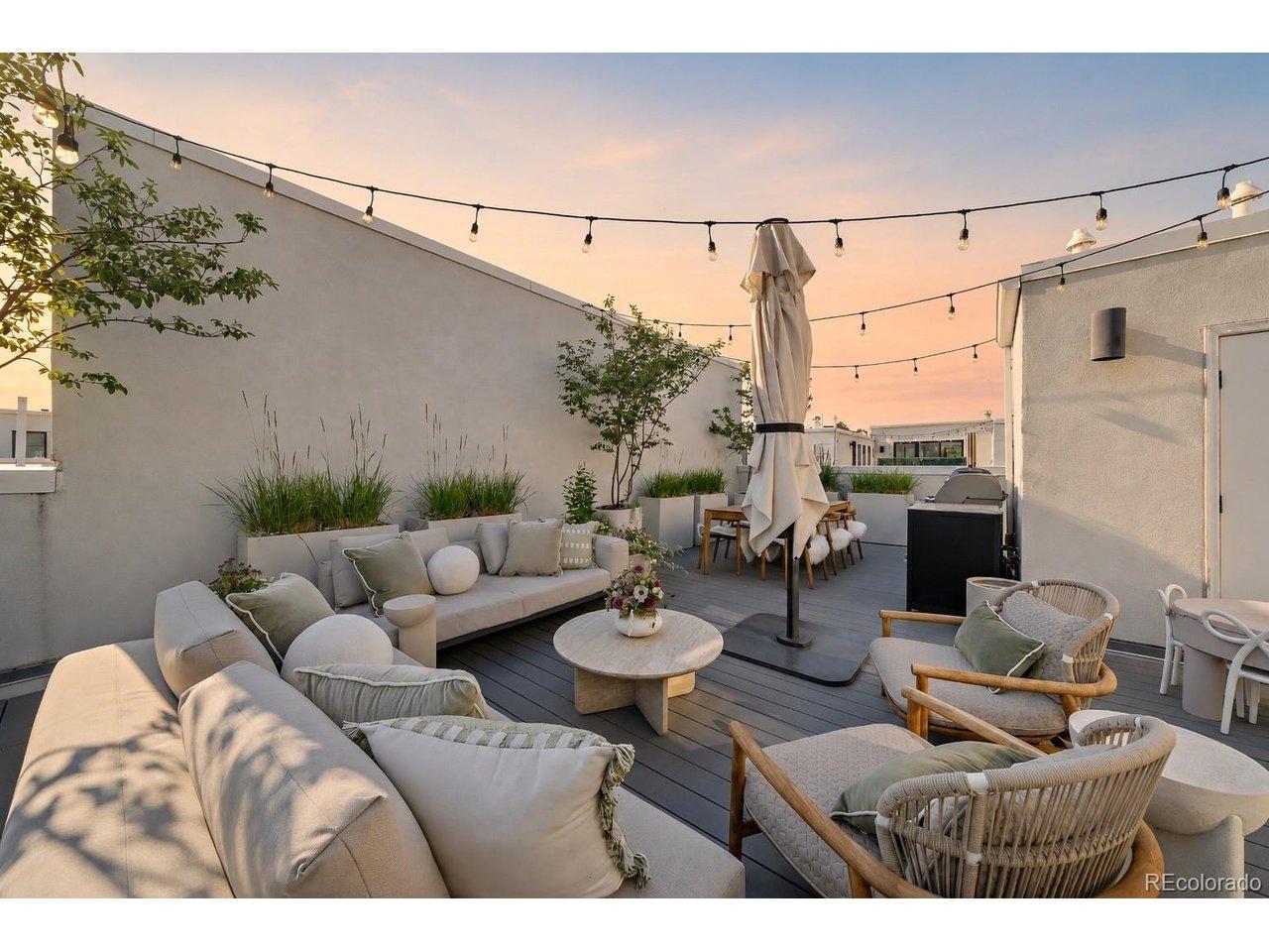 Image 1: Sunset on the rooftop patio