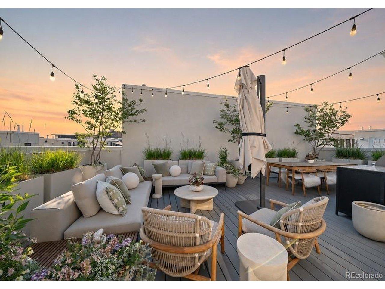 Image 2: Sunset on the rooftop patio