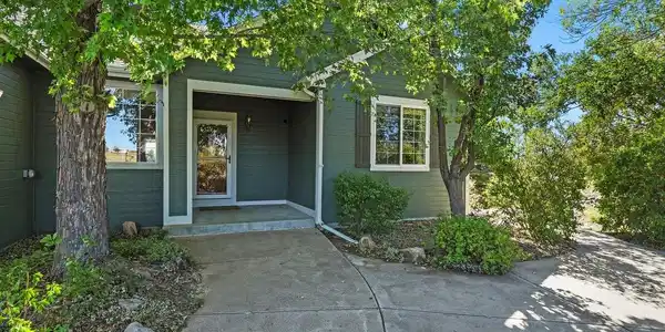 Image 4: Private front patio surrounded by lush landscaping Image 4: Private front patio surrounded by lush landscaping