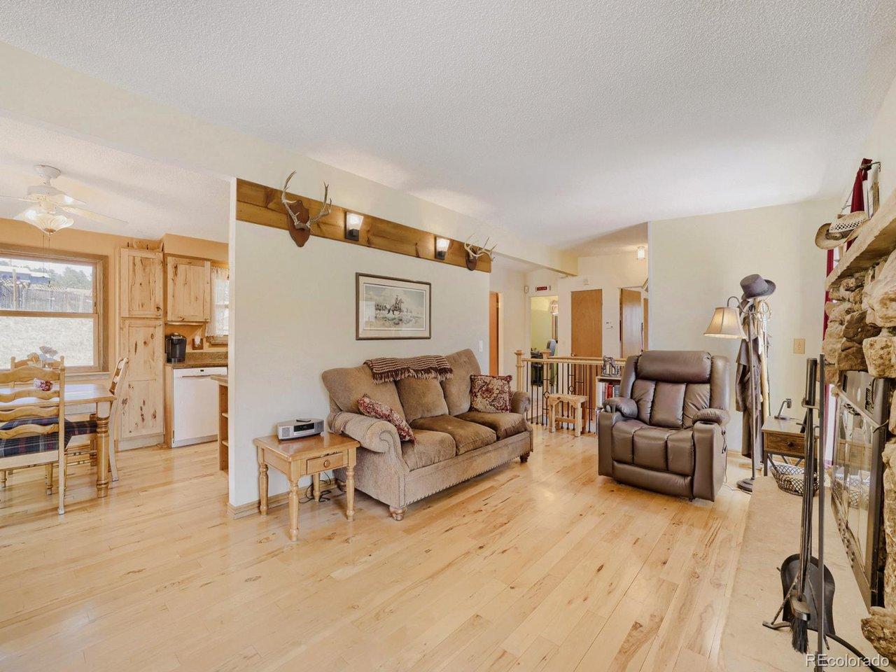 Image 3: Lovely living room with gorgeous hickory floors. Image 3: Lovely living room with gorgeous hickory floors.