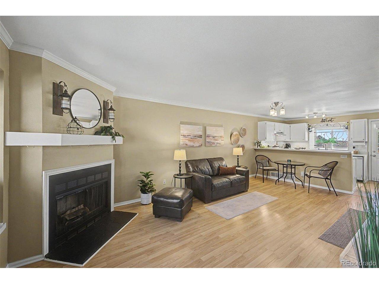 Image 4: Living area featuring open floorplan and fireplace Image 4: Living area featuring open floorplan and fireplace