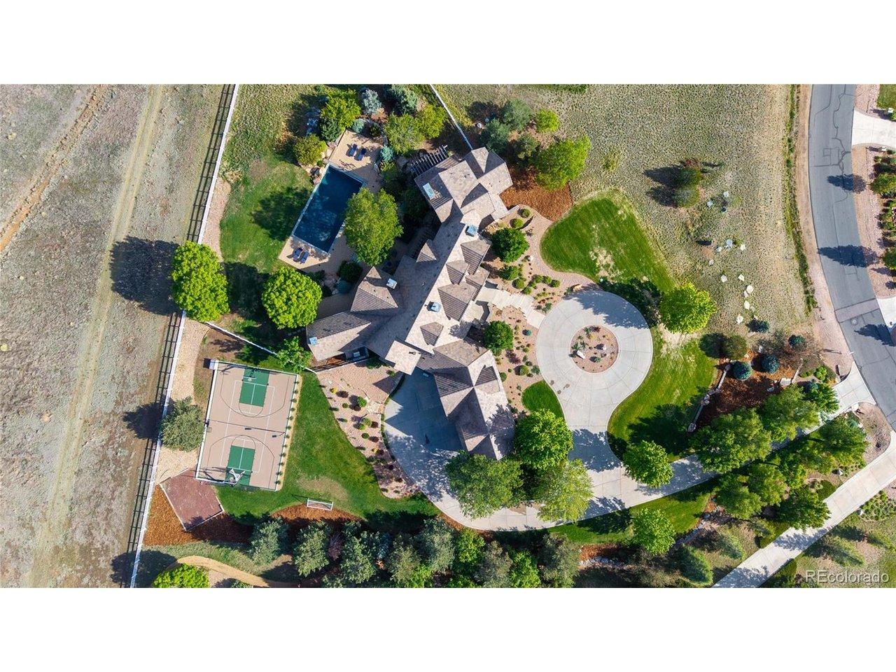 Image 3: This 2.63-acre retreat, backing to Broomfield County Open Space boasts a sparkling pool and private multi-use sports court, all set against the breathtaking backdrop of the Colorado Front Range. Image 3: This 2.63-acre retreat, backing to Broomfield County Open Space boasts a sparkling pool and private multi-use sports court, all set against the breathtaking backdrop of the Colorado Front Range.