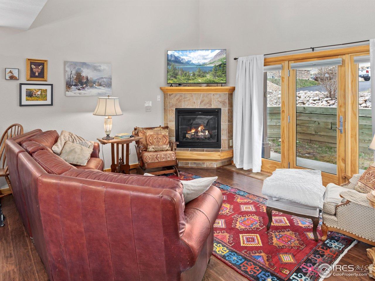 Image 2: Vaulted ceilings, natural light, and a cozy gas fireplace Image 2: Vaulted ceilings, natural light, and a cozy gas fireplace