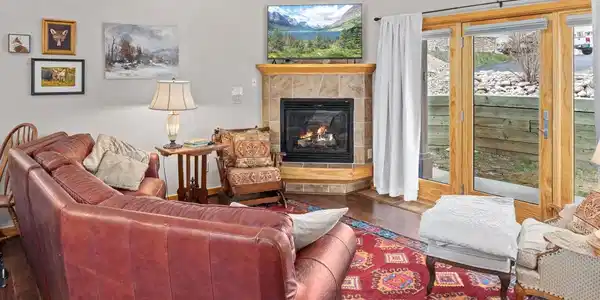 Image 2: Vaulted ceilings, natural light, and a cozy gas fireplace Image 2: Vaulted ceilings, natural light, and a cozy gas fireplace