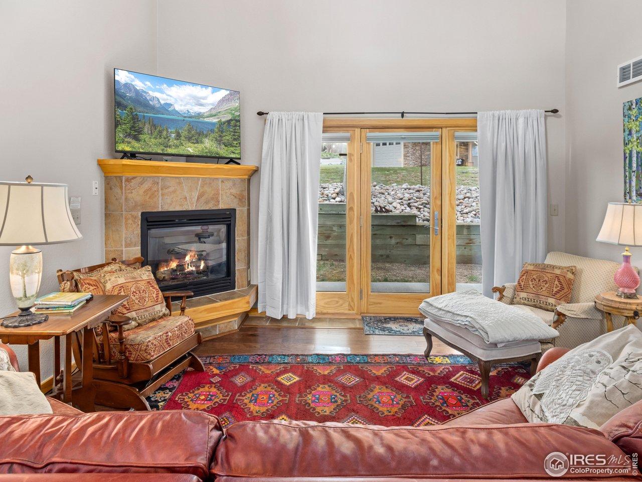 Image 3: Main-Level Living Room with Gas Fireplace Image 3: Main-Level Living Room with Gas Fireplace