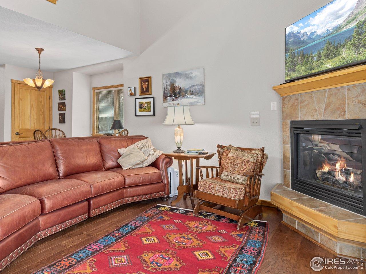 Image 4: Main-Level Living Room with Gas Fireplace Image 4: Main-Level Living Room with Gas Fireplace