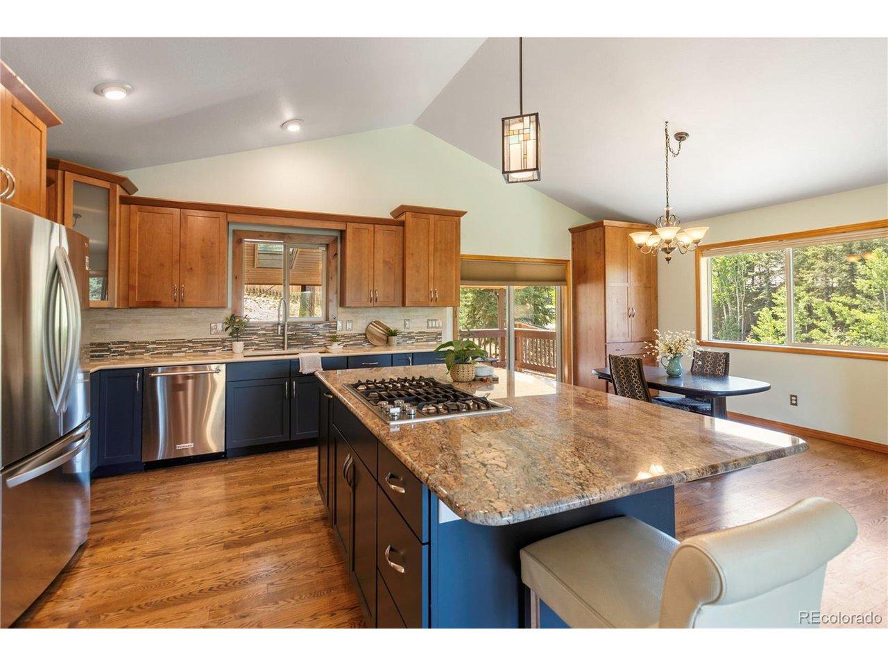 Image 4: Gorgeous oversized granite island with built-in storage