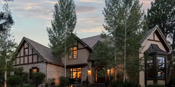 Image 3: A striking custom residence surrounded by lush landscaping and mature trees. Image 3: A striking custom residence surrounded by lush landscaping and mature trees.
