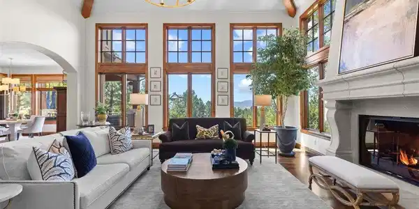 Image 4: Walls of windows frame expansive Front Range views, while soaring vaulted ceilings, exposed wood beams, and abundant natural light create a breathtaking connection to the surrounding landscape. Image 4: Walls of windows frame expansive Front Range views, while soaring vaulted ceilings, exposed wood beams, and abundant natural light create a breathtaking connection to the surrounding landscape.