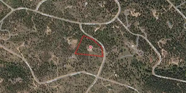 Image 4: Map of home, with lot boundaries marked in red (approximate). The 3.45 acres is fully fire-mitigated, with flat land ready for barn, horses, outbuilding, garage, etc. Home is situated in center of lot, with privacy from neighbors.