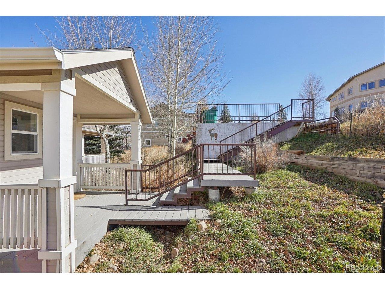 Image 4: Covered front porch with stairs ascending to Grand Ave. Image 4: Covered front porch with stairs ascending to Grand Ave.