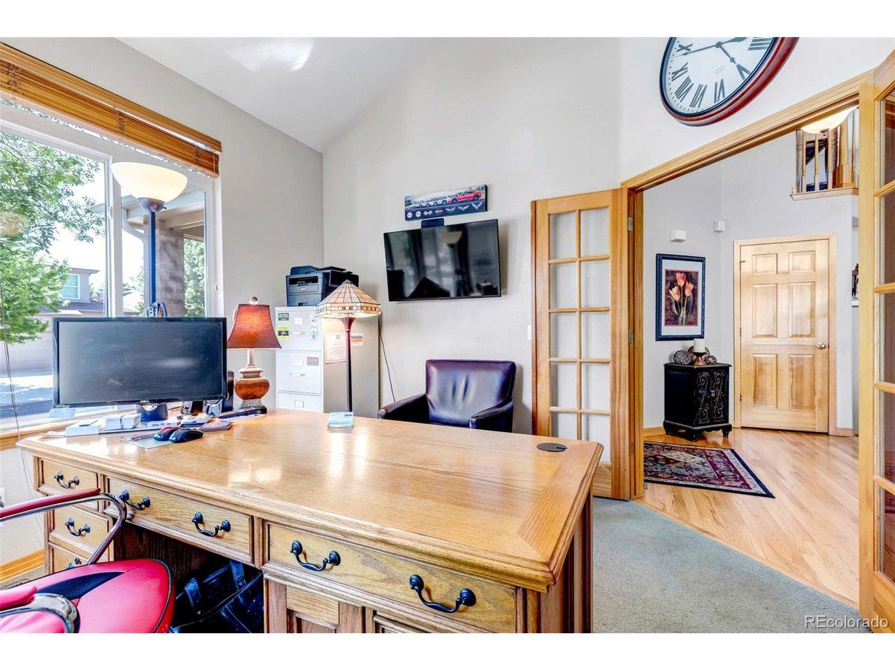 Image 4: Office off of the foyer facing the street with wood trim glass French Doors. Image 4: Office off of the foyer facing the street with wood trim glass French Doors.