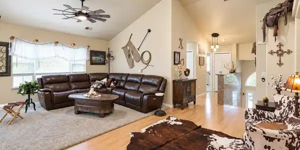 Image 4: Living room looking toward the front door entry and secondary bedroom and bath Image 4: Living room looking toward the front door entry and secondary bedroom and bath