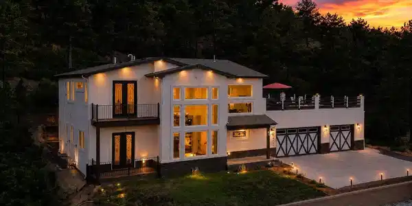 Image 3: Sunset view of home with expansive composite deck for outdoor dining, relaxation, and entertaining. Image 3: Sunset view of home with expansive composite deck for outdoor dining, relaxation, and entertaining.