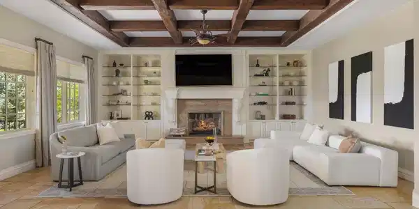Image 2: Exposed beams, substantial built-ins and a fireplace bring warmth and architectural character to the spacious main-level gathering room. Image 2: Exposed beams, substantial built-ins and a fireplace bring warmth and architectural character to the spacious main-level gathering room.