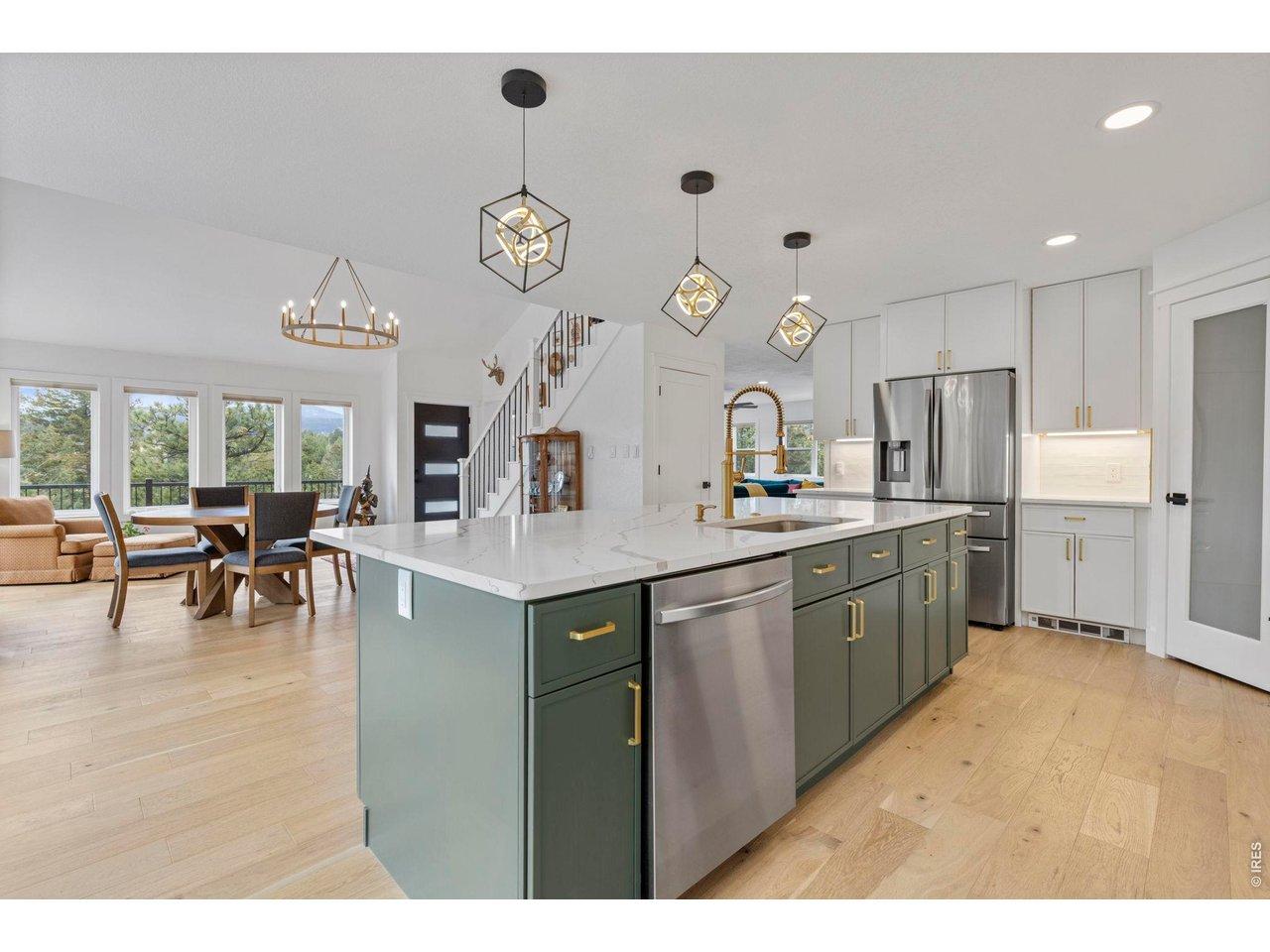 Image 3: The kitchen flows into the dining area with high ceilings and expansive, breathtaking vistas.