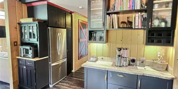Image 4: Kitchen has been completely remodeled and expanded. A woodworking artist did some beautiful touches. Image 4: Kitchen has been completely remodeled and expanded. A woodworking artist did some beautiful touches.