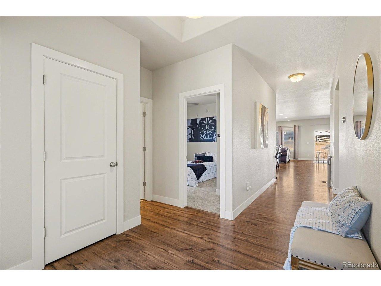 Image 4: The foyer welcomes you with an open and inviting atmosphere, featuring 9-foot ceilings, a spacious layout, and a convenient coat closet. Image 4: The foyer welcomes you with an open and inviting atmosphere, featuring 9-foot ceilings, a spacious layout, and a convenient coat closet.