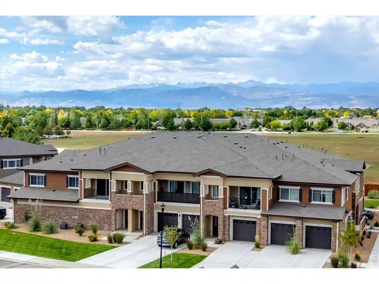 Image 1: Welcome home to Sonoma Village's newest condos with full Front Range Mountain Views from the back balcony patio!