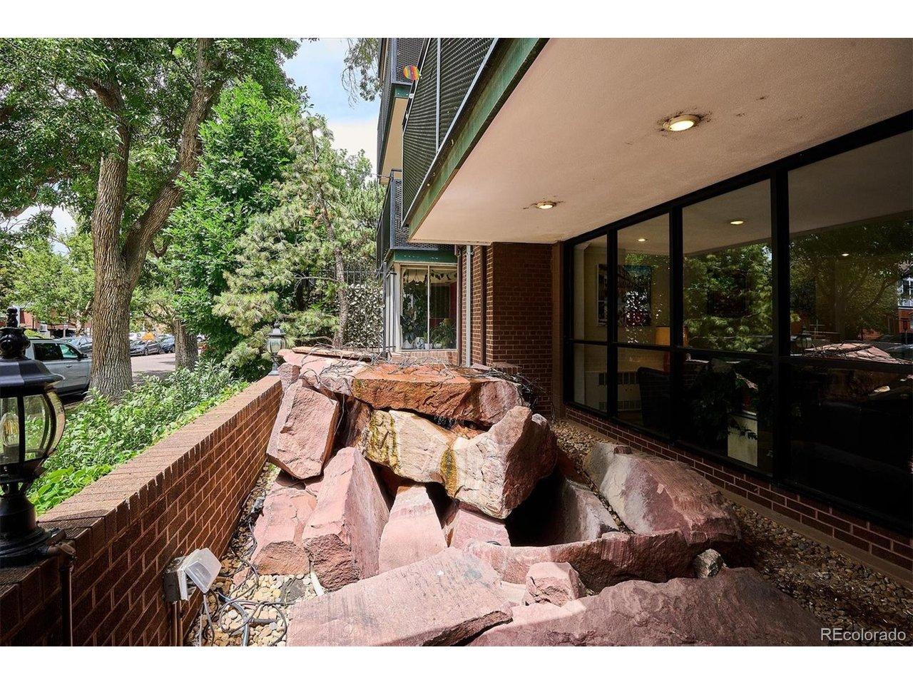 Image 3: Fountain graces the entry garden