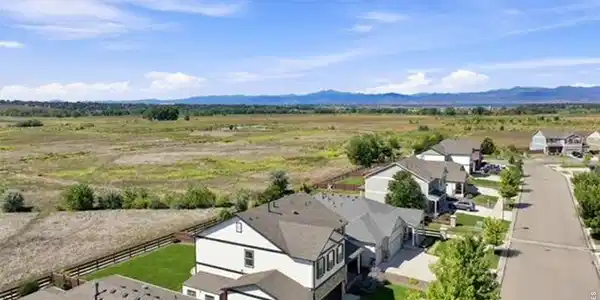Image 2: Aerial showing behind the house and Mountains in the background Image 2: Aerial showing behind the house and Mountains in the background