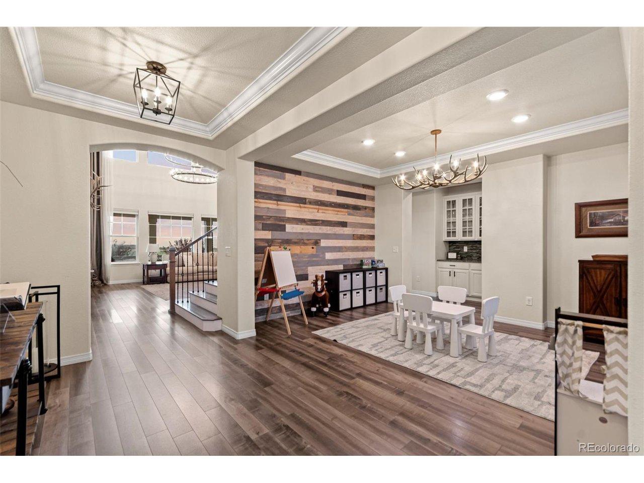 Image 3: Front entry and Dining Area/Playroom/Lounge. Beautiful Wood Accent wall with antler chandelier Image 3: Front entry and Dining Area/Playroom/Lounge. Beautiful Wood Accent wall with antler chandelier
