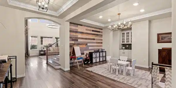Image 3: Front entry and Dining Area/Playroom/Lounge. Beautiful Wood Accent wall with antler chandelier Image 3: Front entry and Dining Area/Playroom/Lounge. Beautiful Wood Accent wall with antler chandelier