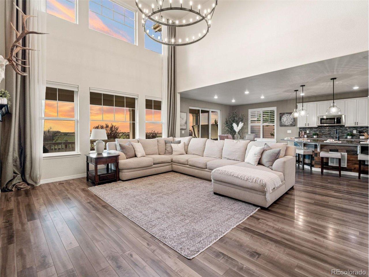 Image 4: Main family room with open concept to the kitchen and dining area. Stunning Mountain Views! Image 4: Main family room with open concept to the kitchen and dining area. Stunning Mountain Views!