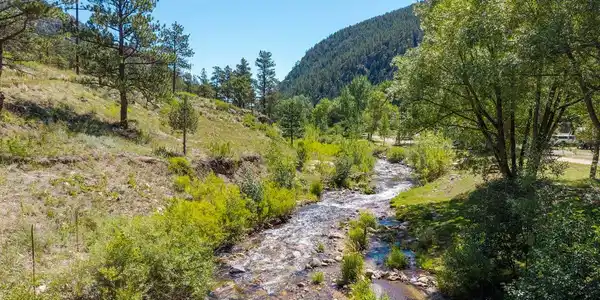Image 2: The North Fork of the Big Thompson River runs through the heart of the property. Image 2: The North Fork of the Big Thompson River runs through the heart of the property.
